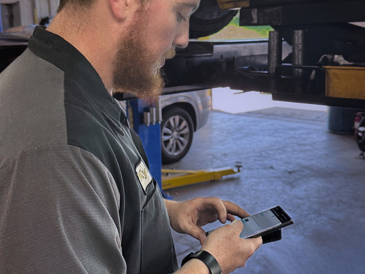Technician documenting findings during a digital vehicle inspection at Mad Hatter Auto Repair in Omaha, Nebraska